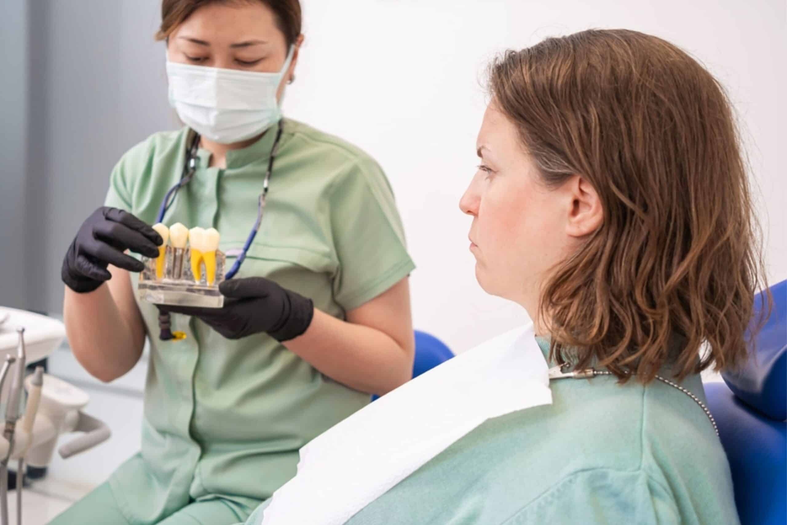 Dentist in Paradise Valley, AZ explaining dental implant options and signs of implant failure to concerned patient